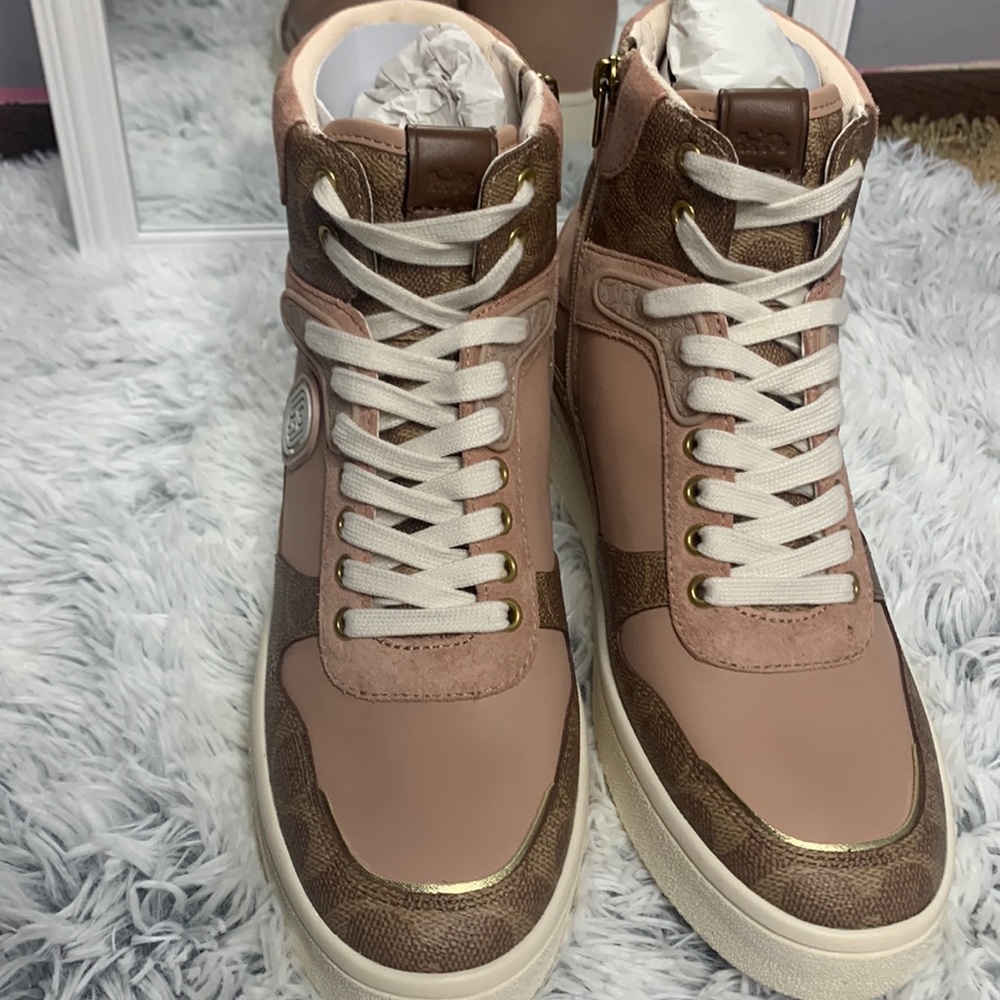 Rose gold coach print high top sneakers.